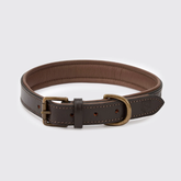 A dark brown leather collar with a matching dark brown interior, featuring antique bronze-toned metal hardware and fine contrast stitching, displayed on a light gray background.