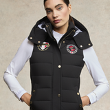 Woman styles the Holland Cooper Team HC Gilet in black with a long sleeved white t-shirt
