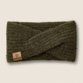 Ariat Ladies Chilton Headband Variant Olive. An olive green ribbed knit twist-front ear warmer with a small brown leather brand patch on the lower left, shown on a light beige background.