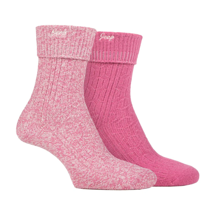 Two pairs of pink socks with a subtle pattern on a white background