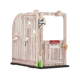 A decorative wooden stable or stable door set with a faux woodgrain finish, featuring a red and white 'LeMieux' brand sign on the door, a small horse silhouette emblem, and a green grass accent at the base, shown on a plain white background.