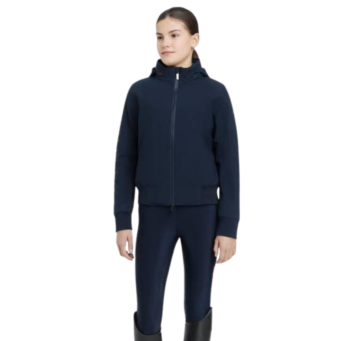LeMieux AW26 Young Rider Team Jacket Variant Colour Navy. A model wearing full navy outfit on white background.