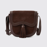 Dubarry Of Ireland Monart Bag Variant Cigar. A dark brown suede and leather crossbody bag with a tassel detail and a small 'DUBARRY' logo on the front, set against a light gray background.