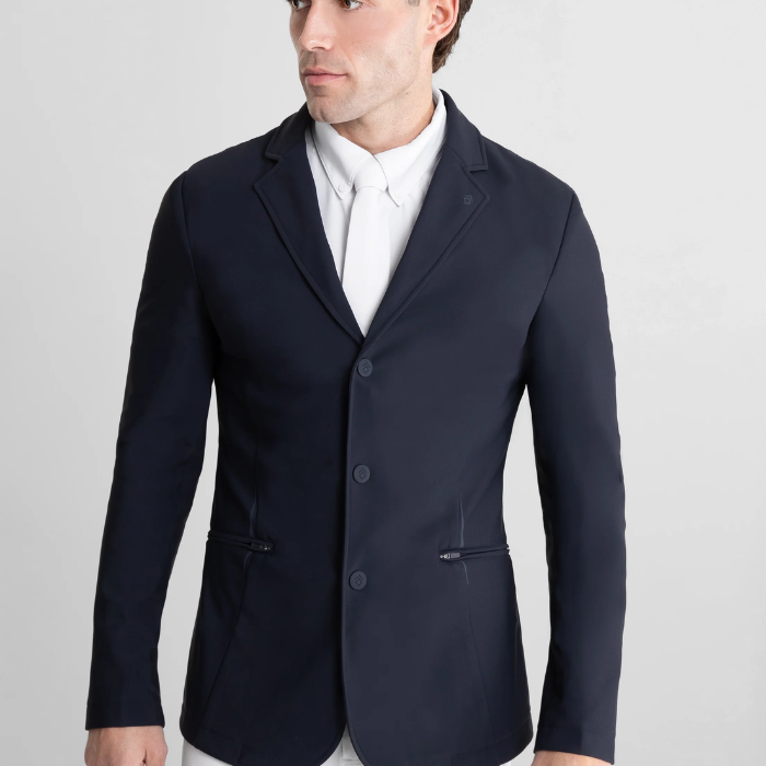 Navy blazer worn by a person on a light gray background