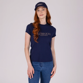 Person wearing a navy blue t-shirt with 'Aubrion Equestrian' logo and a matching cap on a light gray background