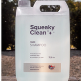 5 liter container of Squeaky Clean yard shampoo with a blurred outdoor background