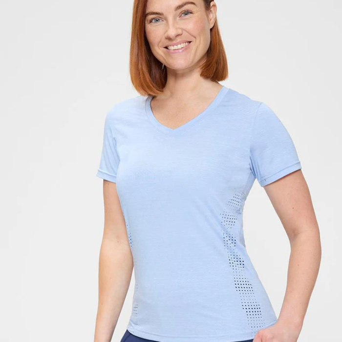 Female model in blue t shirt on white background