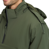 LeMieux AW26 Mens Waterproof Anorak Varient Olive. Close-up of a man wearing an olive green hooded jacket, showing the collar, zipper, shoulder, and part of the neck against a plain white background.