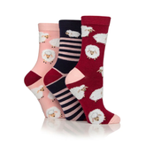 Three pairs of socks with sheep pattern on a white background