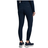 Navy riding pants worn by a person on a white background