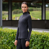 Rider wears the Shires Aubrion React Non-Stop Mid-layer in Shadow