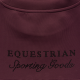 Holland Cooper Cranborne Crystal Crew Variant Mulberry. Close-up of a dark plum-colored garment with 'EQUESTRIAN Sporting Goods' embroidered in black rhinestone lettering across the chest.