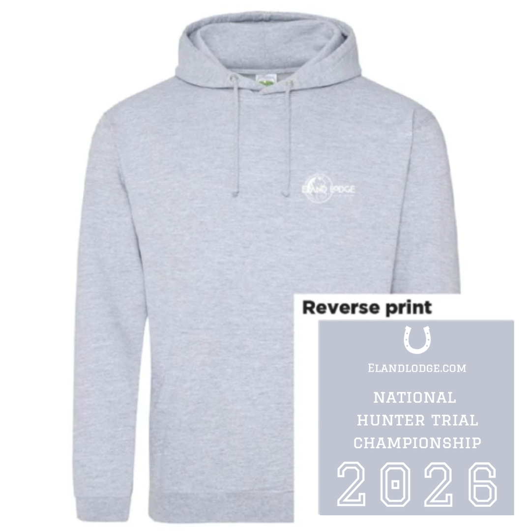 A light heather gray pullover hoodie with a small white 'ELAND LODGE' logo printed on the left chest, shown on a white background with a gray label overlay that reads 'Reverse print' and includes the 2026 National Hunter Trial Championship branding.