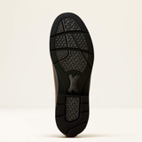Ariat Langley H20 Variant Tobacco Brown. A close-up view of a shoe's black textured rubber outsole, showing the tread pattern and a central logo embossed, set against a plain off-white background.
