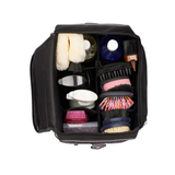 Black bag showing compartments with brushes on white background