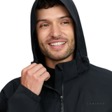 LeMieux AW26 Mens Waterproof Lightweight Jacket Varient Black. A smiling man wearing a black hooded jacket with the brand name 'LEMIEUX' printed on the chest, set against a solid white background.