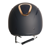 Matte Navy equestrian riding helmet with a metallic Rose Gold accent around the central vent and a black chin strap, shown on a plain white background. Evoke Elara Riding Hat Varient Navy Rose Gold