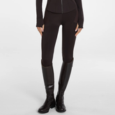 Aztec Diamond AW26 Core Leggings Full Seat Variant Espresso. Brown equestrian riding breeches with textured knee panels, shown on a model wearing matching black riding boots against a light gray studio background.