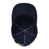 A navy blue baseball cap shown from the inside, featuring a dark navy fabric interior with white embroidered text reading 'HOLLAND COOPER' on the adjustable strap and a small gold metal adjustment slider at the bottom.