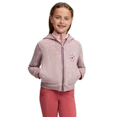 LeMieux AW26 Mini Charlie Hoodie Varient Wild Rose. A young girl smiling while wearing a dusty pink patterned zip-up hoodie with a high collar and pink leggings, photographed against a solid white background.