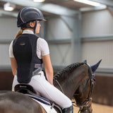 Rider sits on a horse wearing the Airowear Junior Shadow Back Protector