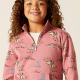 Child wearing a pink patterned sweatshirt with a white background