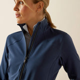 Woman wearing a blue jacket on a beige background