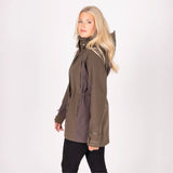 Woman wearing an olive green parka jacket on a white background