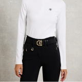 Holland Cooper Stirrup Heritage Belt Variant Colour Black Crystal. A model wearing a white top with 'HC' brand and black leggins with belt with gold clasp, on grey background.