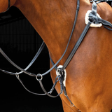 Shires Salisbury Five Point Breastplate Vairant Colour Black.
A light brown horse wearing a brown martingale and breastplate with reins on dark background.