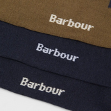 Close-up of Barbour branded socks in brown, navy, and black.