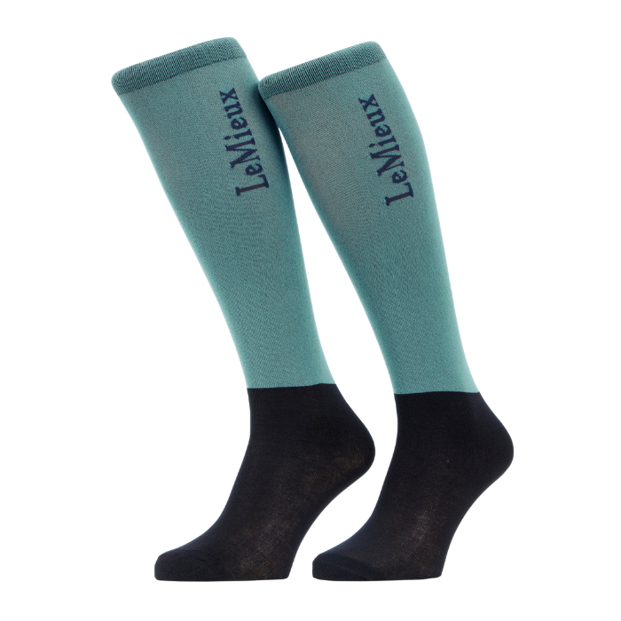 LeMieux AW26 Competition Socks 2 pack Variant Colour Aloe.
A pair of LeMieux knee-high socks with a aloe upper and black lower foot, shown against a plain light gray background.