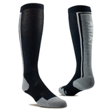 AriatTek Winter Slimline Socks Variant Black/Sleet. A pair of knee-high athletic socks shown on invisible forms against a white background. The socks are primarily black with gray accents on the toes, heels, and sole, and a vertical white stripe with the brand name 'ARIAT' printed in white on the side.