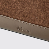 Close-up of a brown and beige product with 'dubarry' branding on a light grey background