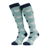 LeMieux AW26 Heart Fluffies Socks Variant Colour Aloe.
A pair of plush knee-high socks in a light aloe green color, featuring a pattern of dark navy blue and pale pinkish-beige hearts, with solid navy cuffs, heels, and toes, shown against a plain white background.