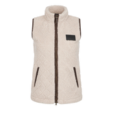 LeMieux AW26 Heritage Borg Gilet Varient Stone. A sleeveless fleece vest in cream with dark brown trim, a dark brown zipper, and a black rectangular patch on the chest, shown against a plain white background.