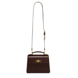 Brown leather handbag with long cross body strap on a white background