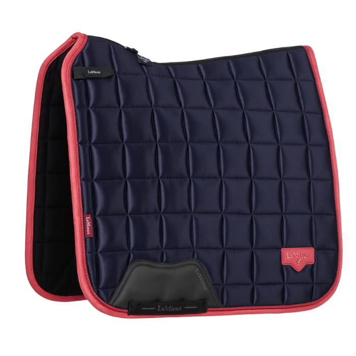 Navy quilted saddle pad with cranberry red border and LeMieux logo on a white background