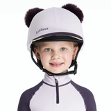 Child wearing a lilac equestrian helmet with black accents and pom-poms, branded 'LeMieux', on a white background.