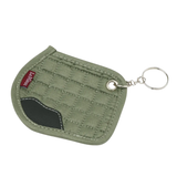 Green quilted saddle pad with keychain on a white background
