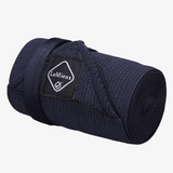 rolled up navy tail bandage with LeMieux branding on a grey background