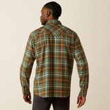 Man wearing a plaid shirt on a beige background