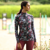 Rider wears the Shires Aubrion React Long Sleeve Base Layer in Abstract