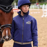 Rider wears the Shires Aubrion Team Blouson in Midnight