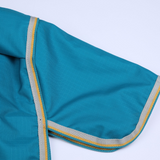 Teal fabric with grey and yellow trim on a white background