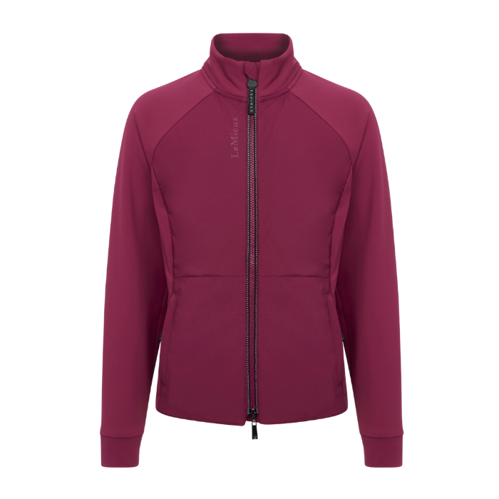 LeMieux AW26 Young Rider Betty Lightweight Jacket Varient Blackberry. A women's full-zip fleece jacket in a deep berry purple color, featuring a stand-up collar, raglan sleeves, and a vertical 'LeMieux' logo on the left chest, shown against a plain white background.