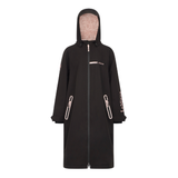 LeMieux AW26 Young Rider HydroShield Robe Varient Black. A black hooded raincoat with a full front zipper, zippered hand pockets, and light pink branding text on the chest and sleeve, displayed on a clean white background.