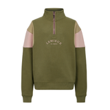 LeMieux AW26 Young Rider Viola Quarter Zip Sweat Variant Colour Willow Green.
A quarter-zip sweatshirt by Lemieux in Willow Green, featuring light green and pink color-blocked shoulder panels, with a pink zipper and white embroidered logo on the chest. On white background.