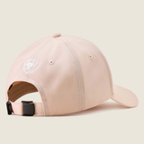Pink baseball cap with brand logo on the back on a beige background