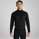 Man wearing a black long-sleeve shirt with a collar on a grey background